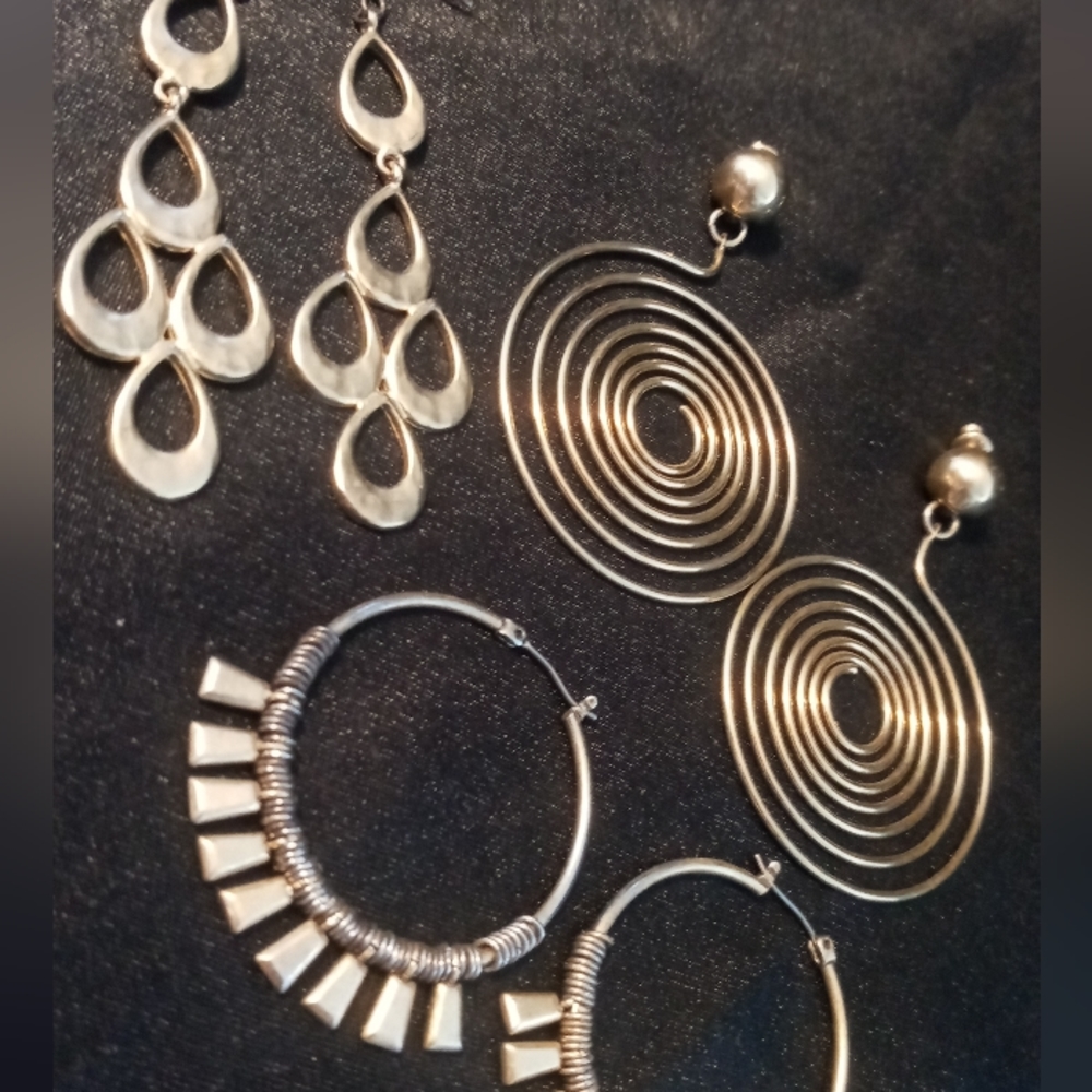Gold tone spiral,hoops, chandelier, and feathered earrings all made well.